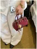 Bolsa Concha Patchwork Estampa de Leopardo Simples Feminina 2026 Verão Nova Bolsa de Mão Textura de Alto Grau Ombro Único Transversal Bolsa Quadrada Pequena