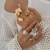 Europa y Estados Unidos joyería transfronteriza viento frío flor pequeña de cinco pétalos anillo de aleación creativo anillos huecos cuadrados traje nuevos productos