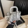 Bolso de mano nicho simple y versátil estilo coreano para mujer, nuevo bolso de hombro y cruzado de moda casual 2026