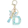 Llavero de Resina de Venta Caliente Transfronterizo 26 Letras Llavero de Moda Colgante de Mariposa Llavero de 26 Letras Mayoreo