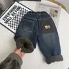 Calças infantis com forro de fleece calça longa de fleece infantil estilo novo de inverno para bebês jeans grosso quente estilo novo de inverno