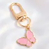 Colgantes de dibujos animados rosas lindos estilo coreano, dijes de aleación de esmalte de conejo y estrella, llaveros con anilla en D, accesorios para manualidades, venta al por mayor