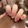 El Artículo de Moda Más Vendido de Celebridad de Internet de Xiaohongshu: Puntas de Uñas Ojo de Gato de Vidrio Dorado Champagne Ligeramente Borrachas con Tonos Rosados que Realzan el Cutis y Añaden un Toque de Lujo