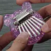 Kalimba de 8 tonos transfronteriza Piano de pulgar Pequeño de 8 teclas Mini instrumento musical Piano de pulgar Portátil de madera Transparente Piano de pulgar