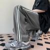Pantalones de seda de hielo para hombre otoño High Street costuras cinta a rayas trapeador pantalones casuales modernos que combinan con todo rectos de pierna ancha