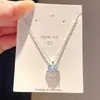 Collar y pendientes de concha con lazo deslumbrante estilo coreano, cadena para la clavícula de lujo ligero de alta gama, conjunto versátil de diseño nicho para mujer