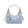 Bolso de axila moderno y artístico de estilo coreano con forma de media luna, con colgante de lazo en forma de corazón de perla, correa de hombro ajustable, bolso de hombro único para mujer