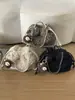 Bolsa Nueva de Mujer Otoño 2026 Bolso Cubo Moderno y Único Bolso de Hombro de Felpa Bolso Esponjoso de Color Sólido de Alto Valor
