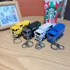 Llavero creativo de mini coche deportivo de fricción, coche de aleación con puertas que se abren, accesorio para mochila infantil, regalo de coche