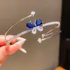 Pulsera Abrible Mariposa de Zirconia de Tres Capas Transfronteriza Europea y Americana Moda Versátil para el Trabajo Diseño de Joyería de Nicho para Mujeres