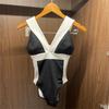 Traje de baño transfronterizo 2022 nuevo versión coreana del bikini sexy blanco y negro sin espalda delgado de tirantes traje de baño de una pieza para mujer al por mayor