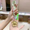 Colgante Flor de Dinero Chapado en Oro, Llavero para Teléfono Móvil, Colgante para Bolso, Regalo Promocional para Clientes, Venta al por Mayor