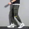 Pantalones cruzados nuevos para hombre, estilo coreano, modernos, corte holgado, estilo ins para estudiantes, pantalones cargo chic casual cortos, marca de moda, con puños en los tobillos