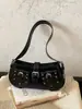 Bolso bandolera retro de moda para mujer, nuevo bolso de verano 2026 de nicho de alto valor con tachuelas y hebilla de cinturón, bolso de hombro