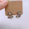 Pendientes de Botón con Lazos Plisados Vintage 2026 Nuevo Popular Diseño de Nicho Moda Versátil Pendientes para el Día a Día