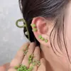 Pendientes Dobles Brillantes Verdes para Mujer 2026 Nuevo Estilo Popular Diseño de Alta Gama Clavos para Cartílago Auricular Pendientes de Lujo Discreto