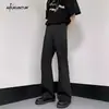 Pantalones de otoño de color liso, de alta gama, de corte holgado para hombre, con un diseño de estilo Hong Kong de alta costura, versátiles, sencillos, adelgazantes y que alargan las piernas, con un ligero corte acampanado