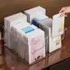 Caja de almacenamiento portátil nueva y práctica para mascarillas faciales, organizador de escritorio transparente compartimentado para cuidado de la piel y labiales para uso en el baño