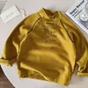 Camiseta de Manga Larga T2026 para Niños Invierno Nuevas Llegadas Niños y Niñas Puntadas de Contraste Base Estampada Camiseta Gruesa para Bebé Ropa Interior Versátil