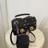 Bolso de mujer 2026 primavera nuevo modelo bolso de axila para ir al trabajo, bolso de hombro cruzado de diseño de nicho, moderno y simple
