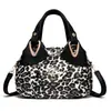 Bolsa de mão feminina estilo chinês 2026 nova coleção primavera/verão, bolsa de mão para mulheres de meia-idade, bolsa tote color-block, bolsa de couro estampada para passeios