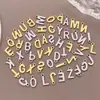 Acero Inoxidable Galvanizado Estilo Europeo y Americano 26 Letras Inglesas Etiqueta Colgante Pulsera Collar DIY Hecho a Mano Accesorios de Joyería