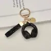 Llavero de Audífonos con Pedrería de Cristal Llavero Musical Completamente Cubierto de Pedrería Adorno Colgante de Cuerda de Diamante para Bolso Accesorios Llavero de Coche