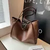 Bolso de hombro de moda transfronterizo para mujer, nuevo modelo 2026, color liso, bolsa de mano de gran capacidad, bolso de trabajo elegante y texturizado