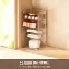 Caja de almacenamiento transparente para mascarillas faciales dentro del gabinete del tocador, con cajones y compartimentos para organizar productos de cuidado de la piel, labiales y cosméticos en un tocador