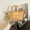 Bolso de mano tejido de alta calidad transfronterizo para mujer, nuevo bolso versátil para el hombro y cruzado para el otoño de 2026