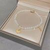 Pulsera Tejida con Cuerda de Perlas y Monedas de los Cinco Emperadores Estilo Chino Nuevo para Mujer, Nicho, Lujo Ligero, Alta Gama, Versátil, Estilo Nuevo 2024