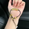 Pulsera de color dorado con pequeño colgante de flor de durazno de la paz para mujer, pequeño amuleto de la fortuna, cuentas de la buena suerte, monedas de los Cinco Emperadores, cuerda tejida a mano, joyería que trae fortuna
