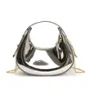 2026 Verano Nuevo Modelo Mini Bolso de Mano Brillo Láser Charol Forma de Media Luna para Niños y Padres Bolso Pequeño Cruzado para Mujer