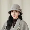 Sombrero tipo cubo de lana de alta calidad para mujer en otoño e invierno, con un elegante diseño de lazo, perfecto para madres y que ofrece un aspecto favorecedor, estiliza el rostro y es cálido