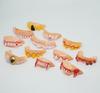 Accesorios de broma del Día de los Inocentes de Amazon transfronterizo, dentaduras postizas de juguete divertidas, dientes de conejo, disfraz de Halloween, dentaduras de descompresión