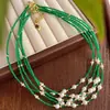Nuevo Collar Retro Chino de Cadena para Clavícula con Piedra Artificial Ojo de Gato Verde Swarovski Perla Blanca Fría