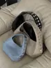 Bolso de mano de nicho retro con tachuelas en forma de media luna para mujer, nuevo modelo de verano 2026, versátil y sofisticado, adecuado para ir al trabajo, bolso de hombro y de axila