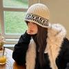 Sombrero de pescador de punto de diseño nicho retro coreano para mujer en otoño e invierno, cálido, con protección para las orejas, de lana, tipo baotou, para el frío, a la moda
