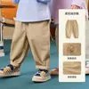 Pantalones JQ Jingqi para niño estilo nuevo otoño infantil algodón puro cargo pantalones largos para niña casual verano para bebé ropa infantil
