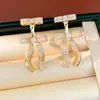 Pendientes de Plata Recubiertos de Oro Real de 18K con Aguja de Plata y Circonita en Forma de Lazo, Pendientes Únicos de Nicho con un Toque de Lujo Ligero y de Alta Gama, Venta al por Mayor
