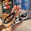Llavero Creativo Nuevo de Zapatilla de Baloncesto Aj, Colgante Exquisito de Moda para Mochila y Llave de Coche para Hombres y Mujeres, Ventas Directas de Exportación