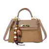 Bolso pequeño de alta gama para mujer 2026 nuevo estilo moderno otoño invierno bolso de mano de moda bolso cuadrado pequeño textura nicho bolso de un solo hombro bandolera