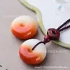 Venta al por mayor de fábrica colgante de hebilla de seguridad de Jade dorado natural de Xinjiang colgante de marca de pan gota de agua suministro en vivo al por mayor