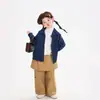 Ropa Infantil Nuomi Wanzi 2026 Otoño Pantalones Casuales de Algodón Puro para Niñas con Solapa Trasera y Etiqueta Parcheada, Pantalones Rectos, Pantalones Falda para Niños al por Mayor