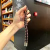 Nuevo Llavero de Colores Miu Cordón Bolsa Llave de Coche Colgante de Moda Versátil Tejido a Mano Pequeño Regalo