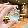 Cuentas de burbujas transparentes rellenas de aceite blanco luminoso botella de arena movediza creativa adornos de cristal de escritorio acrílico llavero colgante