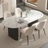 Mesa de comedor de color crema, moderna y lujosa con tapa de piedra para uso doméstico, con un diseño moderno y minimalista de forma ovalada negra, adecuada para comedores