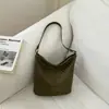 Bolsa tipo cubo texturizada de moda casual de nicho con patrón tejido, modelo nuevo de verano 2026 para trabajo y desplazamientos, bolso de hombro para mujer