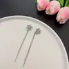 Pendientes de borla con copo de nieve incrustado de diamantes exquisitos franceses estilo elegante de socialité atmósfera un dos en uno sensación de lujo ligero de alta gama pendientes