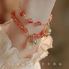 Recomendación de Libro Rojo Pequeño diseño de nicho ins para amigas estilo nacional lujo ligero seda dorada colgante de campana pulsera para amigas pulsera